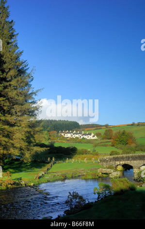 Bellever in Devon with a modern bridge crossing the East dart River besides the remains of the ancient clapper bridge Stock Photo