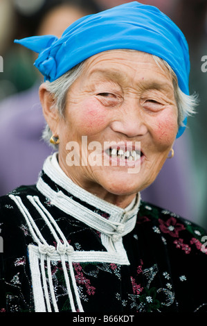 Traditionally dressed ethnic Mongolian attends summertime Naadam Festival Xiwuzhumuqinqi Inner Mongolia China Stock Photo