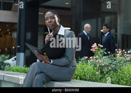 Businesswoman looking at a file Stock Photo