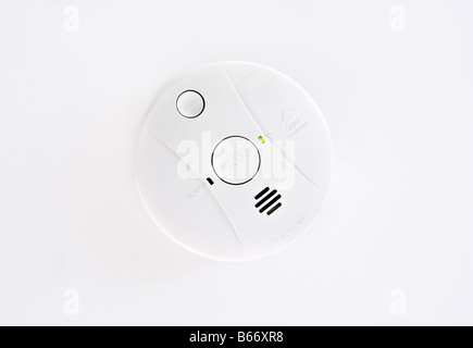 A smoke alarm attached to the ceiling Stock Photo