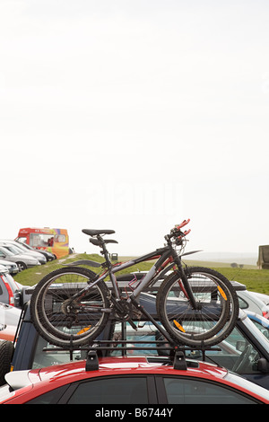 Bicycles on car in car park Stock Photo