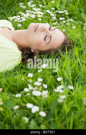 Woman sleeping on grass Stock Photo