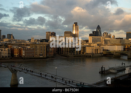 view over the thames and of the city of london with the new walking bridge between the south and north banks looking north from Stock Photo