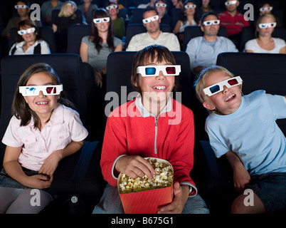 Children watching a 3d movie Stock Photo