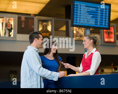 A couple buying tickets from the box office Stock Photo