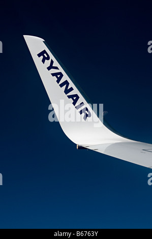 airplane wing tip in flight of a boeing 737 800 of a Ryanair plane ay high altitude Stock Photo