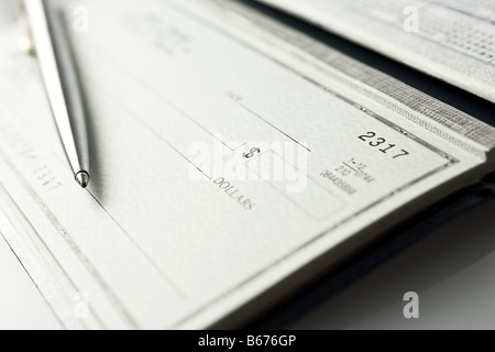 Cheque book and pen Stock Photo