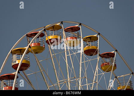Ferris wheel in caernarfon north wales part of a travelling fair in the central square Stock Photo