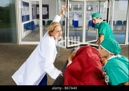 Medical team in front of hospital Stock Photo