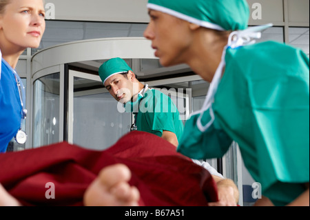 Medical team in front of hospital Stock Photo