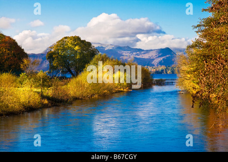 The view from Pooley Bridge onto the River Eamont as it flows into Ullswater in the Lake District Cumbria England UK Stock Photo