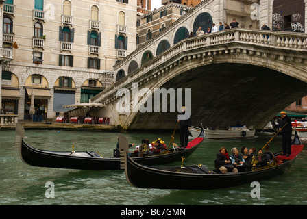 Two gondolas under Rialto bridge in Venice Italy Europe Stock Photo