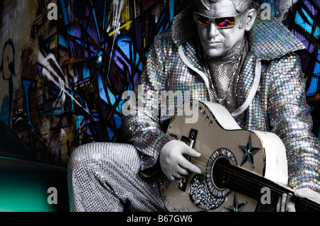 Silver Elvis playing the guitar Stock Photo