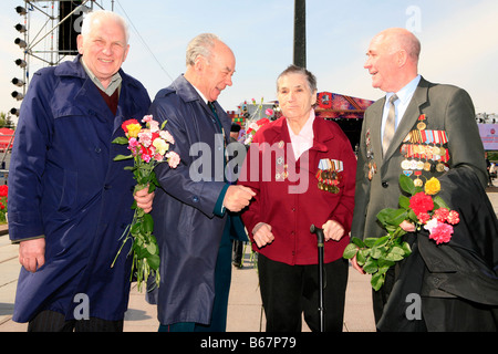 4 Soviet veterans celebrating World War II Victory Day at Victory Park in Moscow, Russia Stock Photo