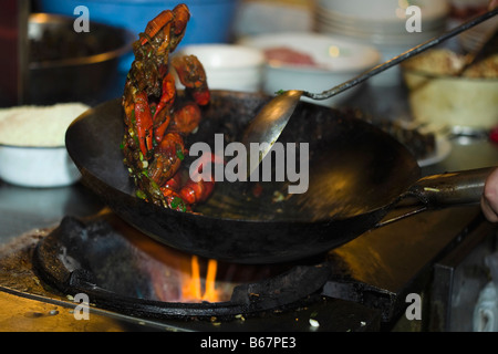 Crab cooking in a wok, Nanjing, Jiangsu Province, China Stock Photo