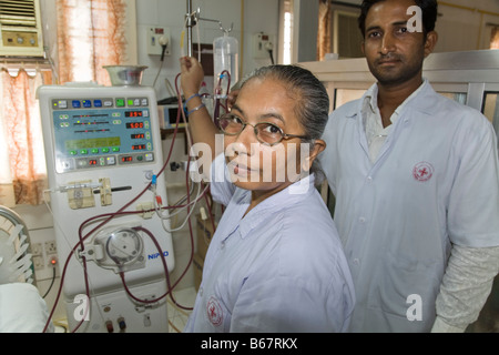 Nurses with a dialysis machine in the renal unit of the New Civil Hospital. Surat. Gujarat. India. Stock Photo