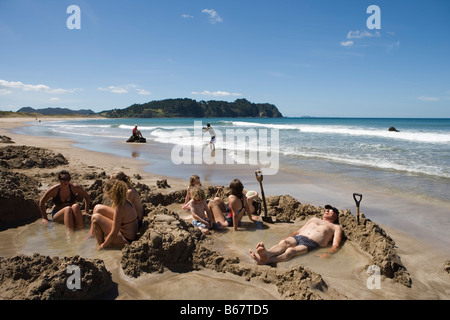 Relaxing in Thermal Pools, Hot Water Beach, Coromandel Peninsula, North Island, New Zealand Stock Photo