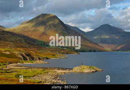 Man standing on promontory, Wastwater, Wasdale, Lake District National Park, Cumbria, England UK Stock Photo