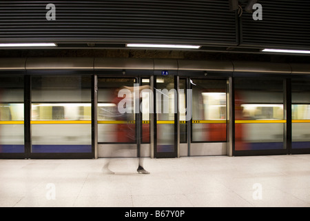 Underground tube train (Jubilee Line) and platform at Canary Wharf station, London, England. Stock Photo
