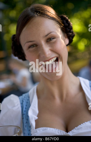Waitress in beergarden near Starnberger See, Bavaria, Germany Stock Photo