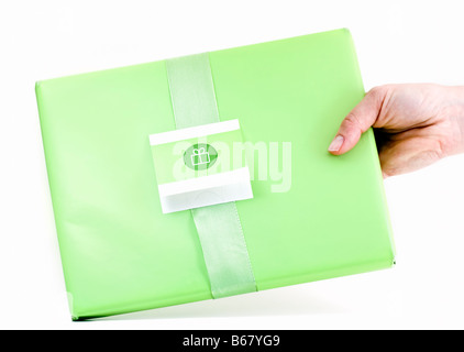 A hand holding a present Stock Photo