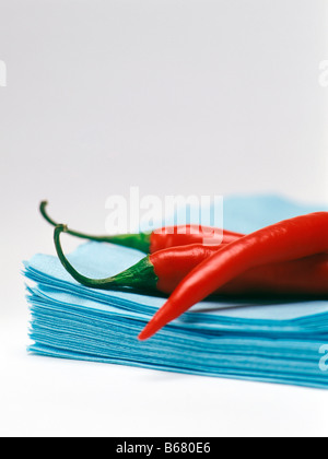 Red Peppers on Blue Napkins Stock Photo