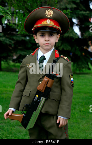 Young boy in a Russian uniform celebrating World War II Victory Day at Victory Park in Moscow, Russia Stock Photo