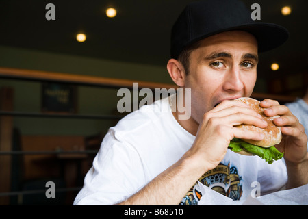 Man Eating Hamburger Stock Photo