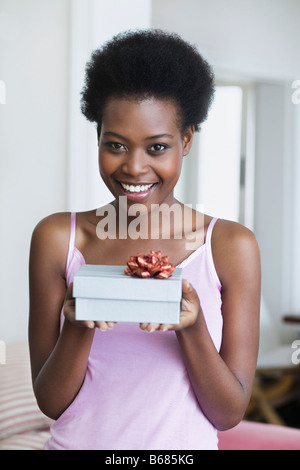 Woman Holding Gift Stock Photo