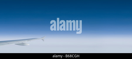 airplane wing plane wing blue sky clouds panorama Stock Photo