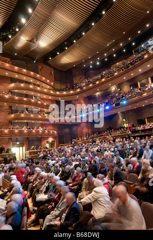 The audience inside the main auditorium the Donald Gordon theatre at the wales millennium centre cardiff wales UK Stock Photo