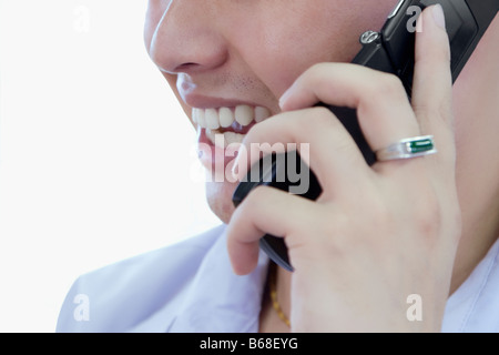 Close-up of a young man talking on a mobile phone Stock Photo