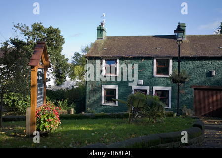 Yew Tree cottage and entrance to St Peters church in Heysham Village Lancashire Stock Photo