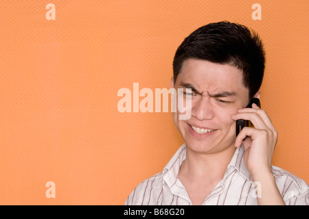 Close-up of a male office worker talking on a mobile phone Stock Photo