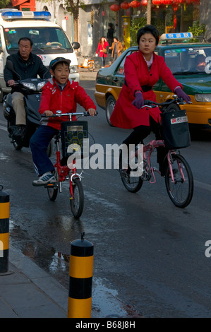 Mother and son son Bicycles Beijing China Stock Photo