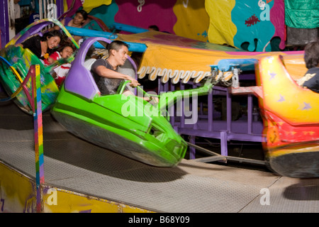 Oaxaca, Mexico. Day of the Dead.  Amusement Ride outside entrance to San Miguel Cemetery. Stock Photo