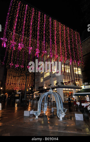 Christmas decorations & lights London West End shopping eating out business area street scene St Christophers Place just off Oxford Street England UK Stock Photo