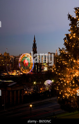 Edinburgh Christmas tree on the Mound with the illuminated  Winter wonderland in background, Scotland, UK, Europe Stock Photo