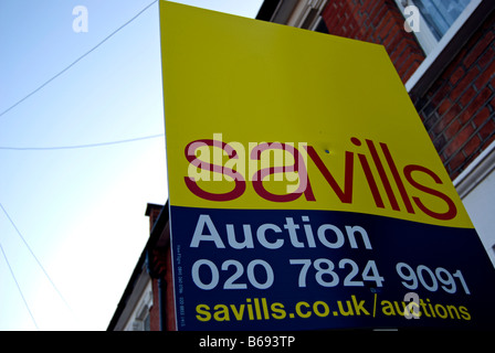 sign for savills estate agents advertising a house for sale by auction, in twickenham,. middlesex, england Stock Photo