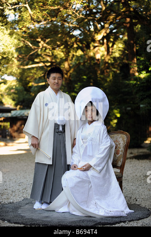 A married couple after their traditional wedding ceremony at Meiji Shrine Tokyo Japan Stock Photo