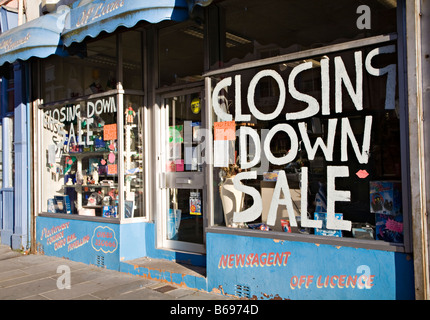 Shop with closing down sale sign in window Merthyr Tydfil Wales UK Stock Photo