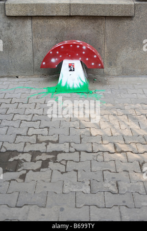 large mushroom made from painted iron plate placed on an alley Stock Photo