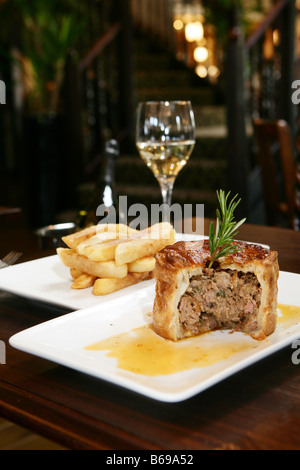 Pie with gravy and chunky ships Stock Photo