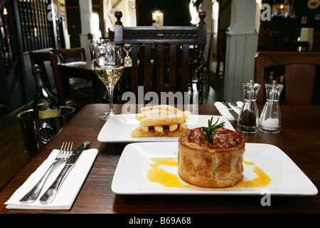 Pie with gravy and chunky ships Stock Photo