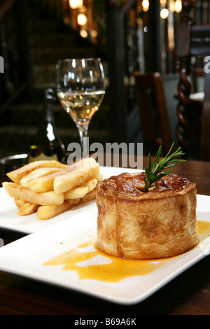 Pie with gravy and chunky ships Stock Photo