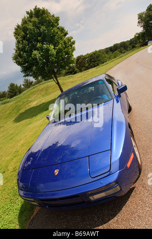 Porsche 944 S2 coupe by a beautiful field Stock Photo