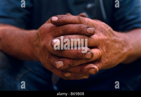 hands of a working man Stock Photo