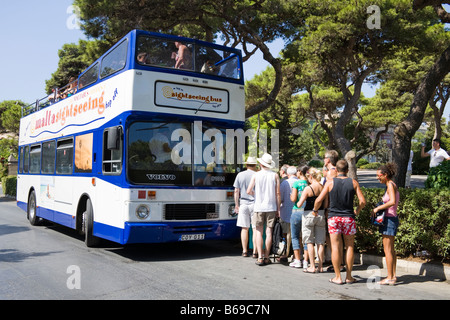 Visitors Boarding An Open Top Tour Bus Outside Haworth Railway Station ...