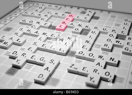 A scrabble game highlights global recession issues of the credit crunch and other financial implications Stock Photo