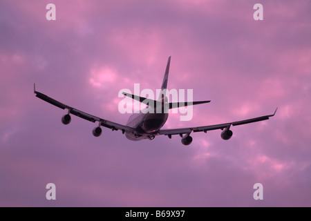 boeing 747 jumbo jet taking off at sunset Stock Photo
